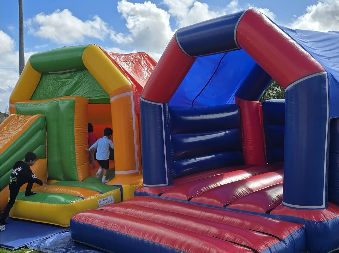Image showing two of the bouncy castles which were available for kids to enjoy on the day.